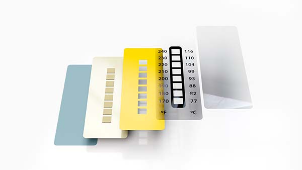 Technischer Querschnitt eines irreversiblen Temperaturmessstreifens 